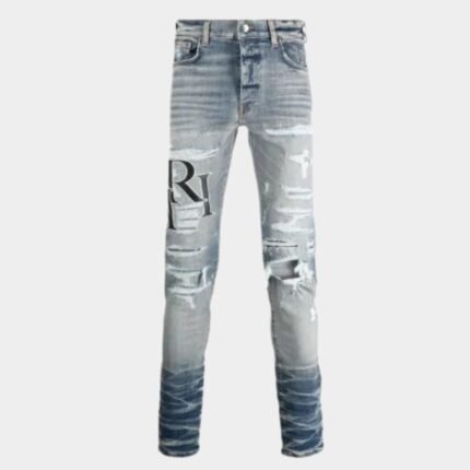 Jean AMIRI slim homme bleu délavé avec effets vintage et patchs logo authentiques
