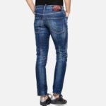 Détail finitions artisanales jean homme coupe slim taille mi-haute